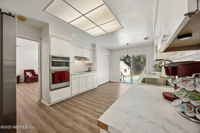 a large white bed in a white room