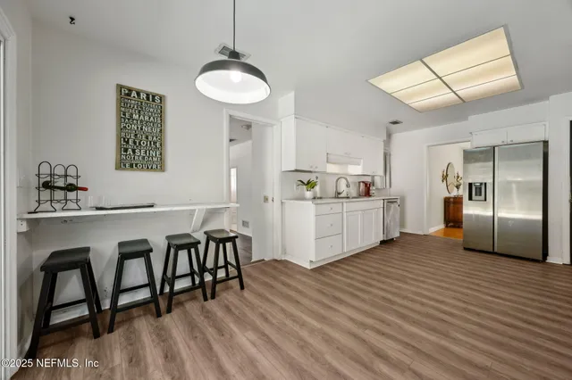 a large white bed in a white room