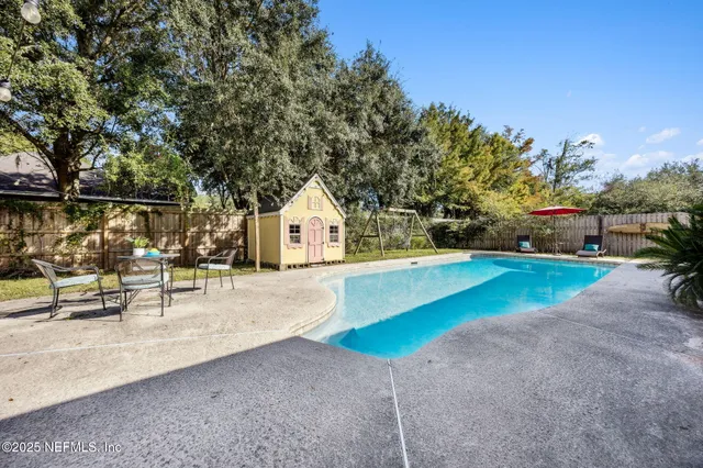 a view of pool with outdoor seating