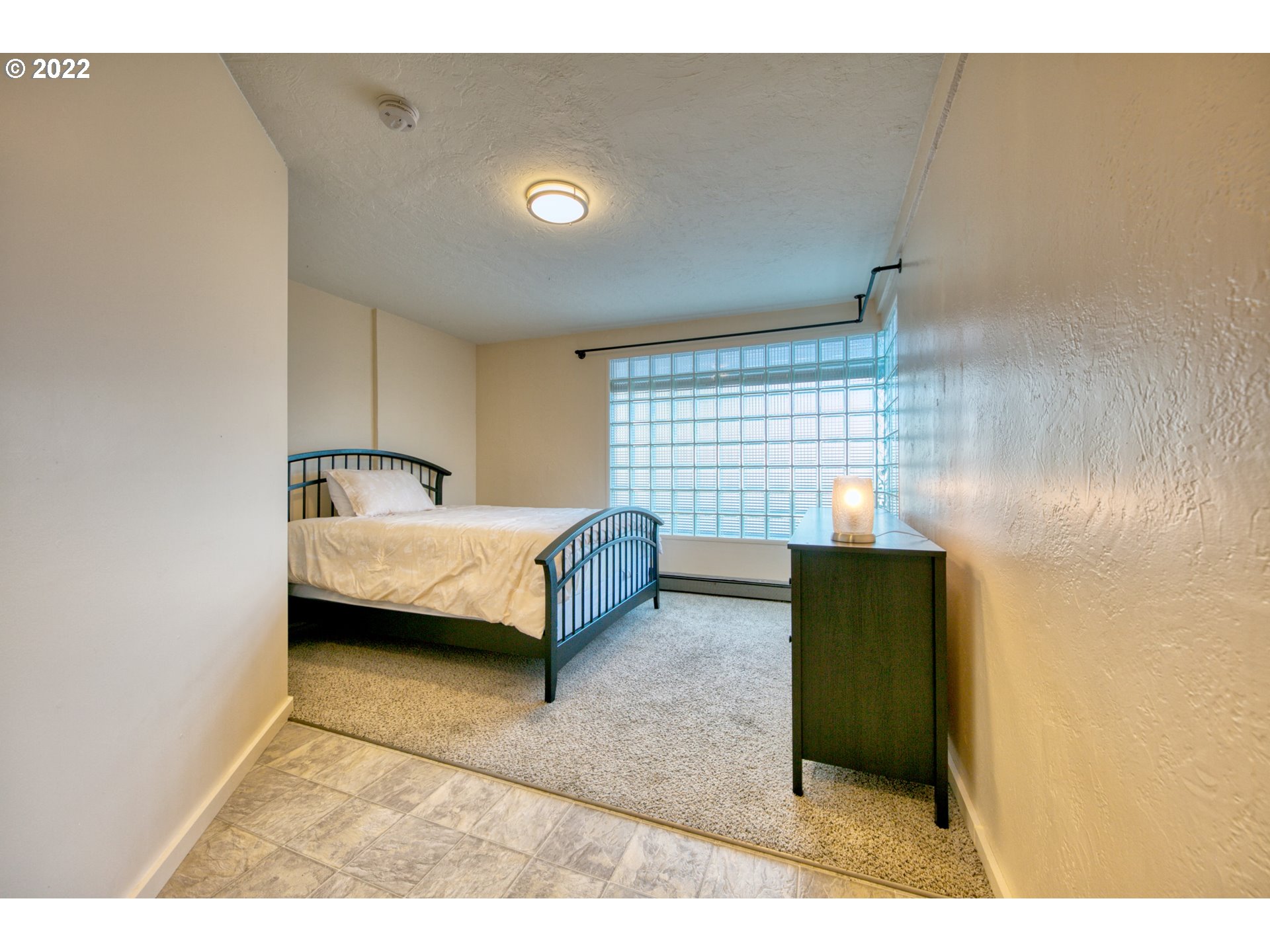 3212 Oriole Street Springfield, OR 97477 - Photo 11 of 20 a bedroom with a bed and a window