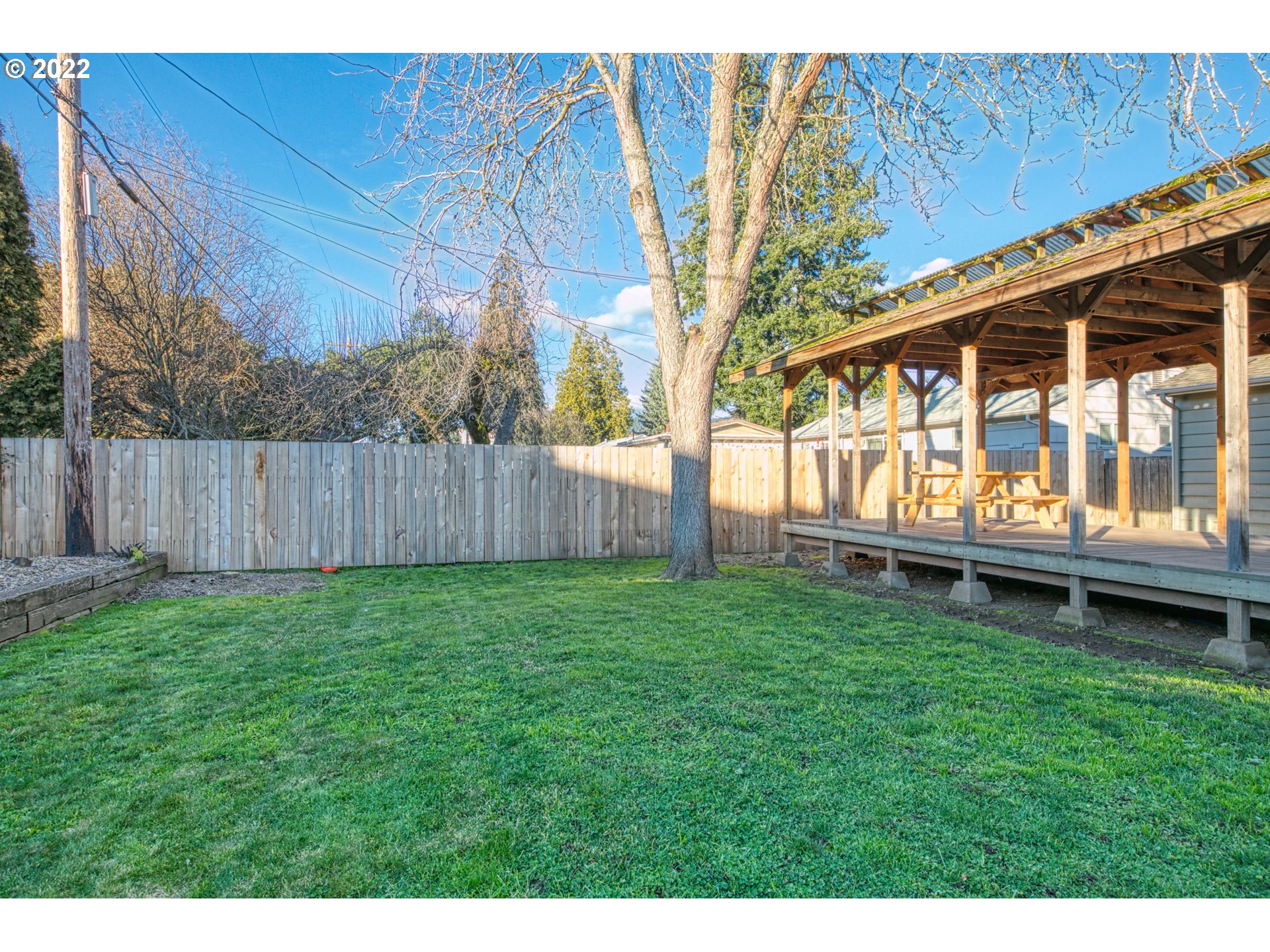 3212 Oriole Street Springfield, OR 97477 - Photo 18 of 20 a view of backyard with wooden fence and large trees
