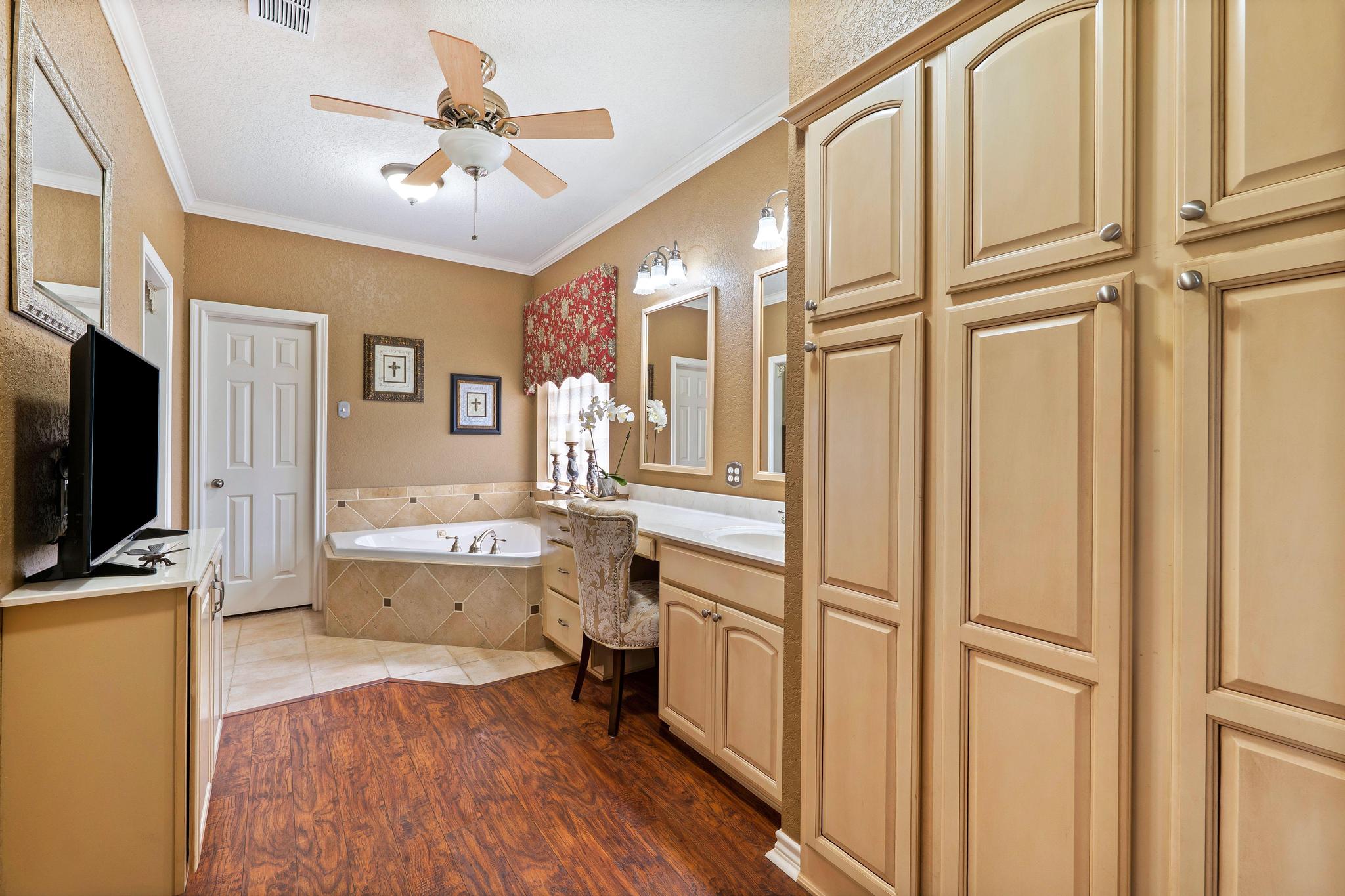 19000 Farm To Market Road 971 Granger, TX 76530 - Photo 19 of 40 The ensuite bath is brimming with abundant storage for your linens and products.