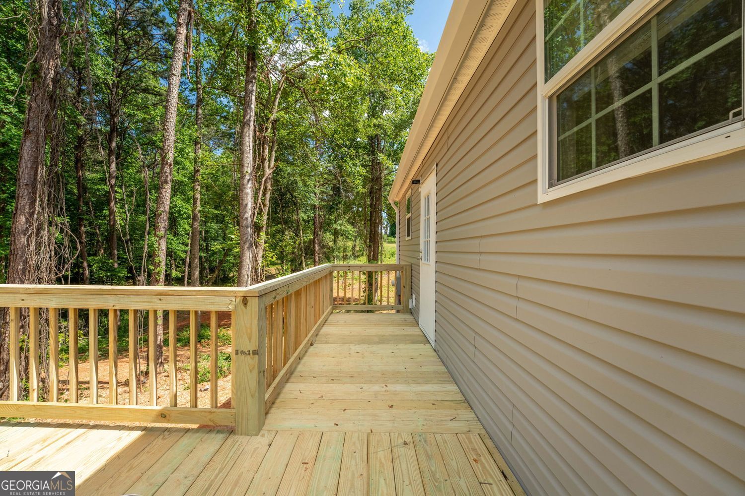 734 Hollywood Church Road Clarkesville, GA 30523 - Photo 37 of 49 a view of a balcony with wooden floor and fence