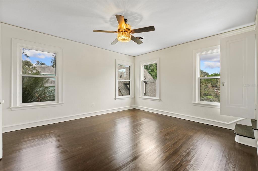 1689 Lakeshore Drive Eustis, FL 32726 - Photo 51 of 76 a view of wooden floor and windows in a room