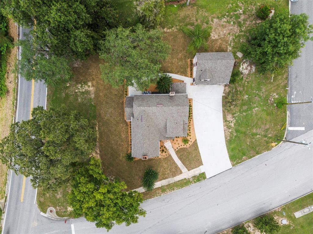 1689 Lakeshore Drive Eustis, FL 32726 - Photo 69 of 76 an aerial view of house with yard