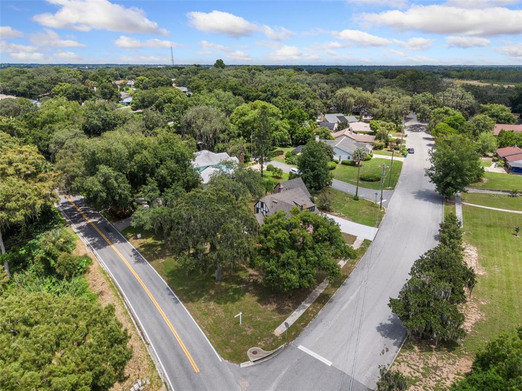 1689 Lakeshore Drive Eustis, FL 32726 - Photo 72 of 76 an aerial view of residential houses with outdoor space and trees