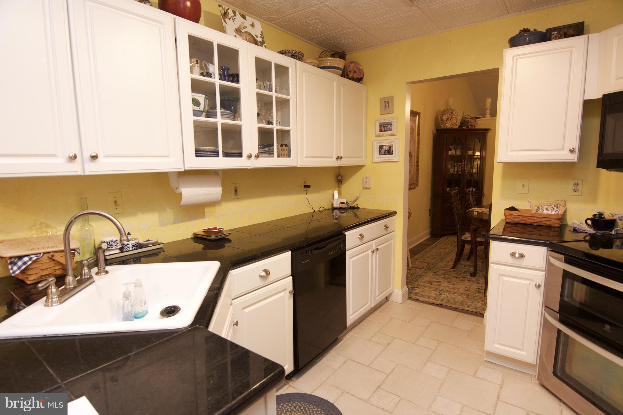 162 Hawthorne Court Reading, PA 19610 - Photo 17 of 32 a kitchen with a sink stove and cabinets