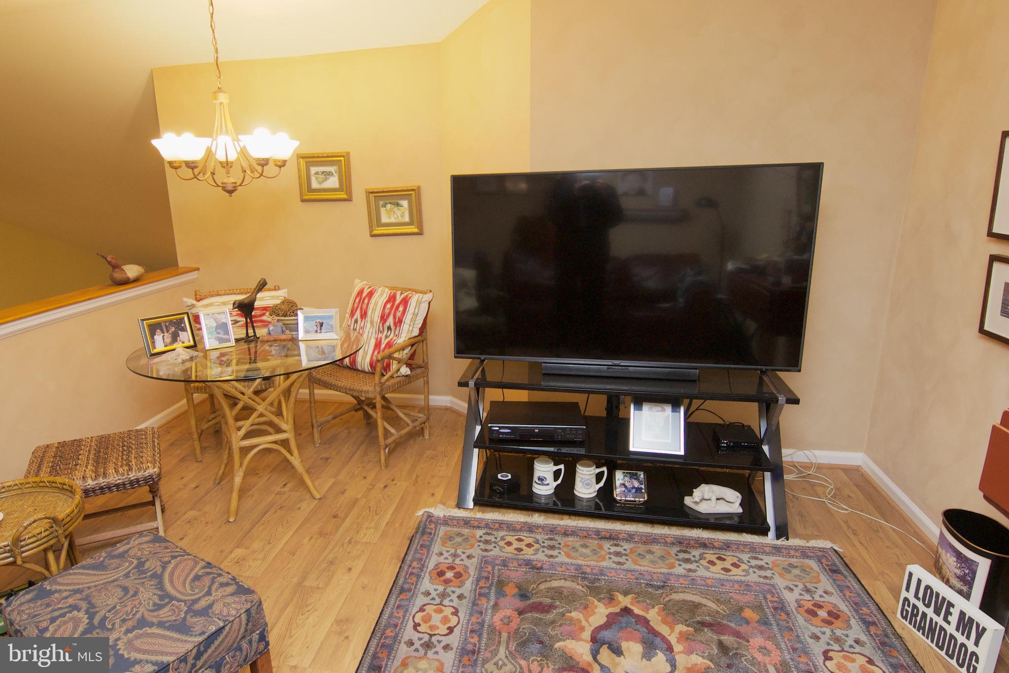 162 Hawthorne Court Reading, PA 19610 - Photo 21 of 32 a living room with furniture a flat screen tv and a table