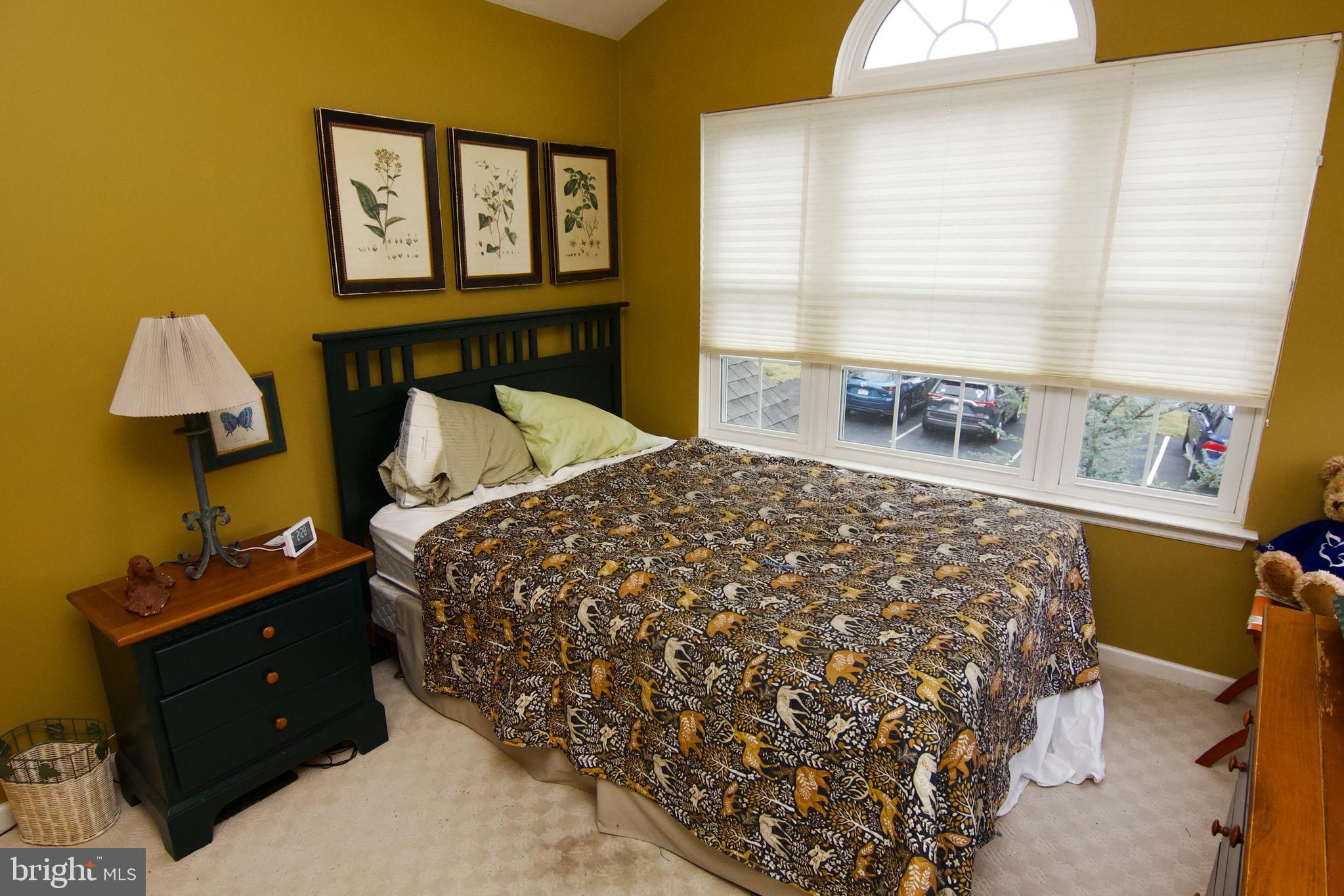 162 Hawthorne Court Reading, PA 19610 - Photo 22 of 32 a bed sitting in a bedroom next to a window