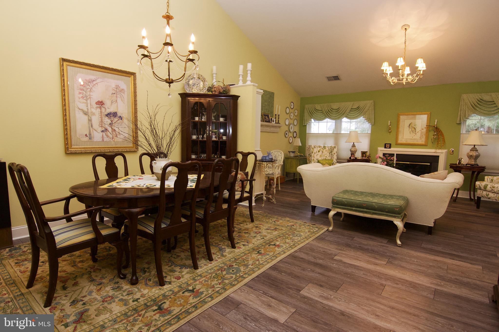 162 Hawthorne Court Reading, PA 19610 - Photo 8 of 32 a view of a dining room with furniture a chandelier and wooden floor
