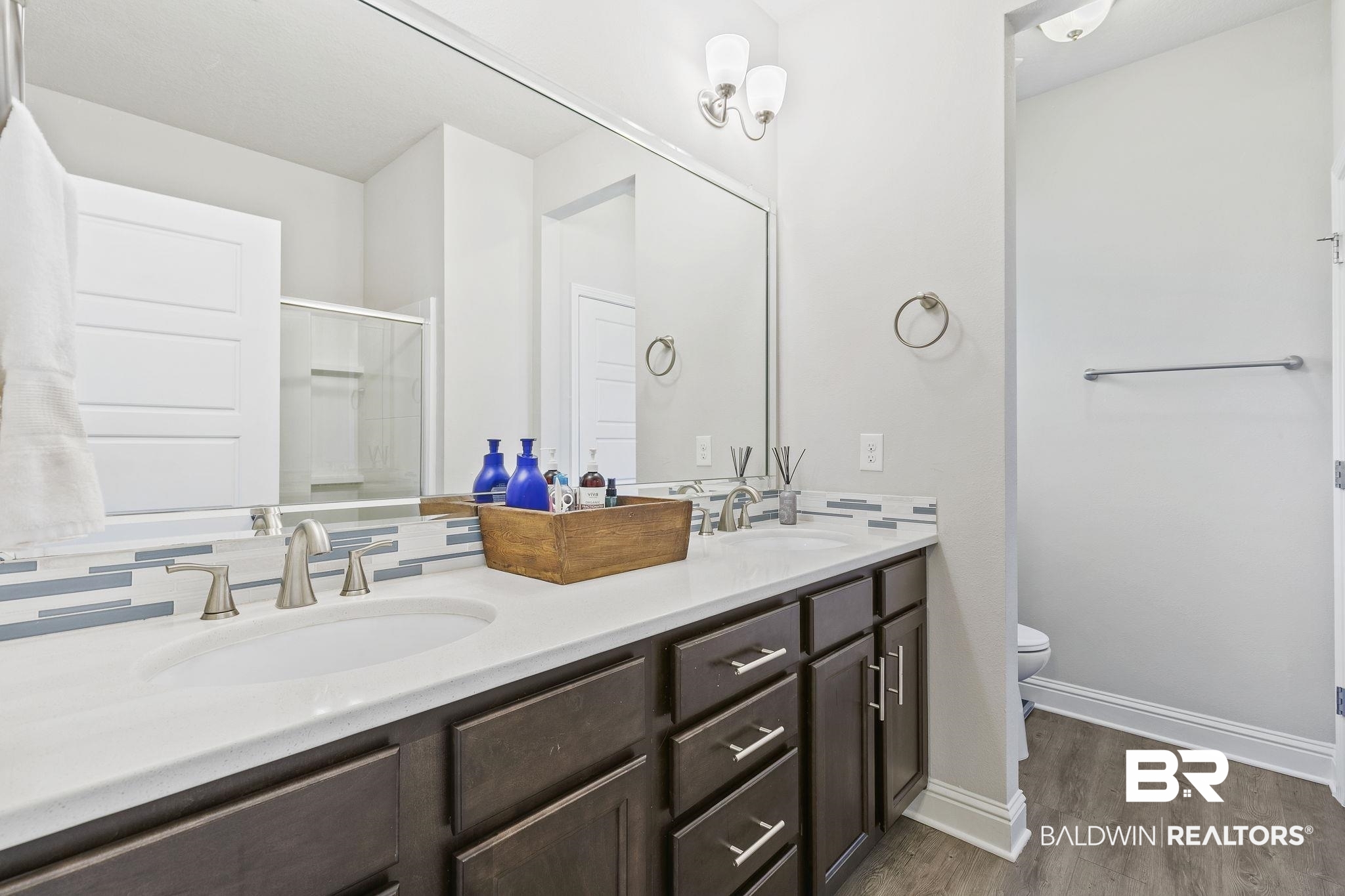 6867 Spaniel Drive, Unit B Daphne, AL 36527 - Photo 17 of 36 Bathroom with hardwood / wood-style flooring, vanity, toilet, and a shower with shower door