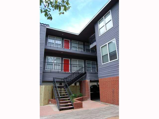 View of apartment building / complex featuring stairway