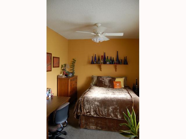 2804 Rio Grande Street, Unit 307 Austin, TX 78705 - Photo 6 of 14 spacious bedroom with ceiling fan and a desk