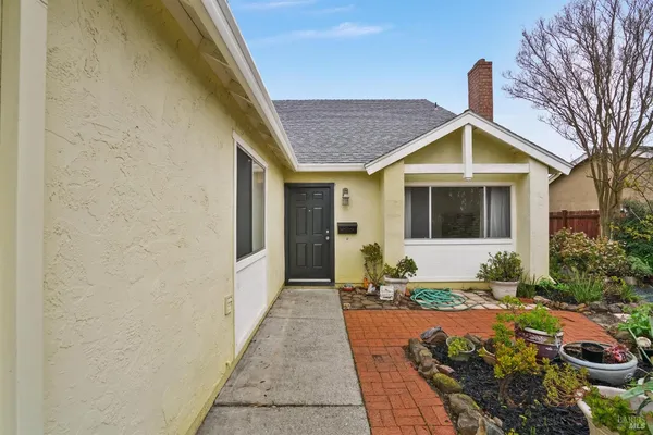 a front view of a house with garden