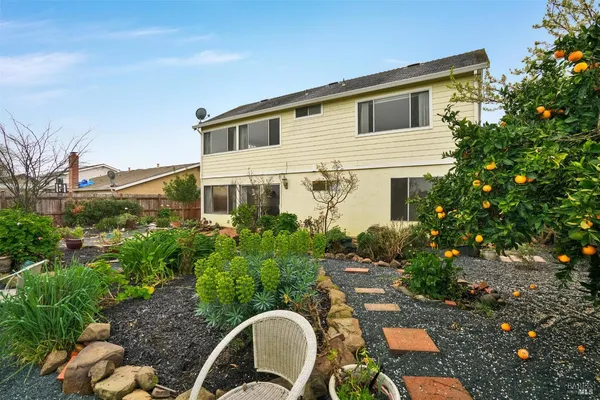 an aerial view of a house with a garden