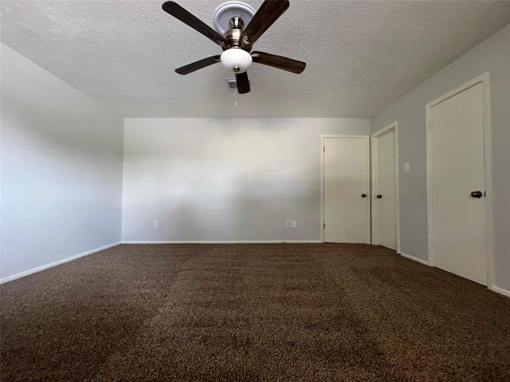 7012 Jetty Lane Houston, TX 77072 - Photo 15 of 24 an empty room with closet and windows