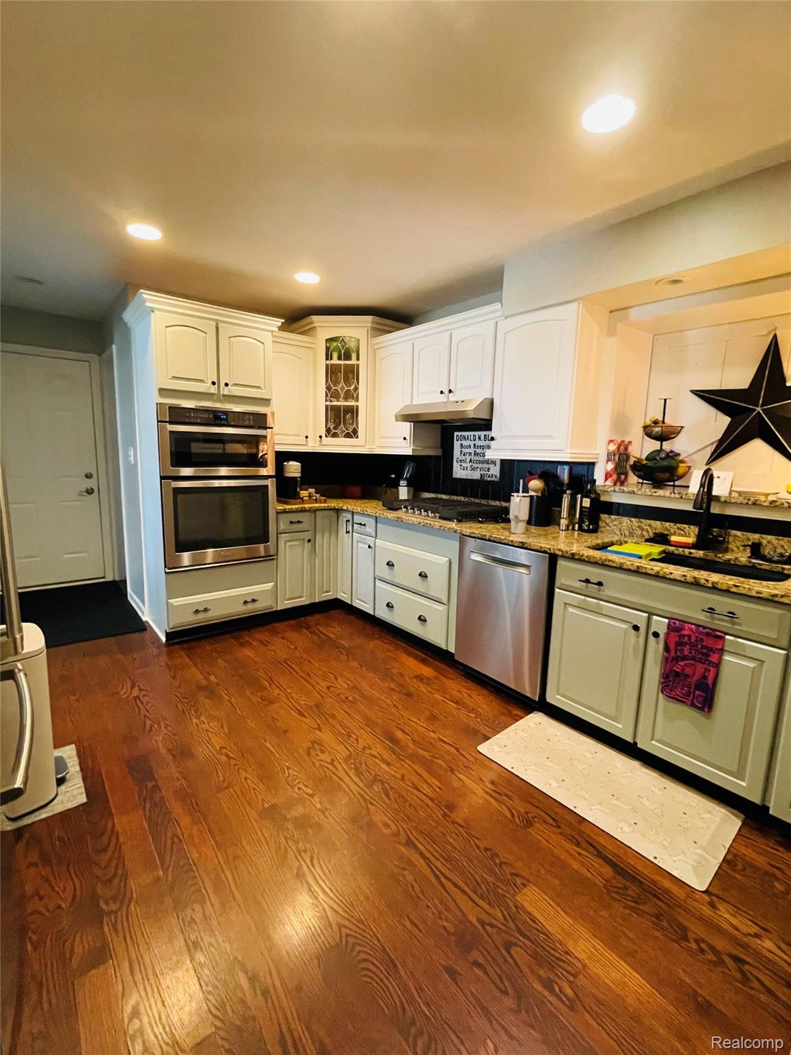 488 Welch Road Northville, MI 48167 - Photo 2 of 22 Kitchen featuring wood-finish flooring, recessed lighting, and a combination of white and light green cabinetry