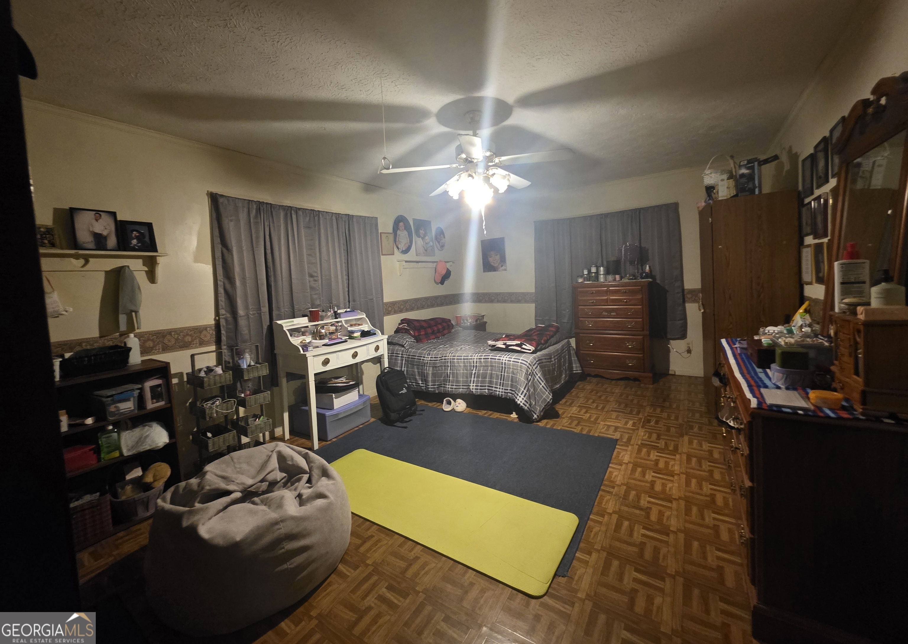 1407 Rainbow Circle Griffin, GA 30224 - Photo 19 of 23 a room with furniture a flat screen tv and a fireplace