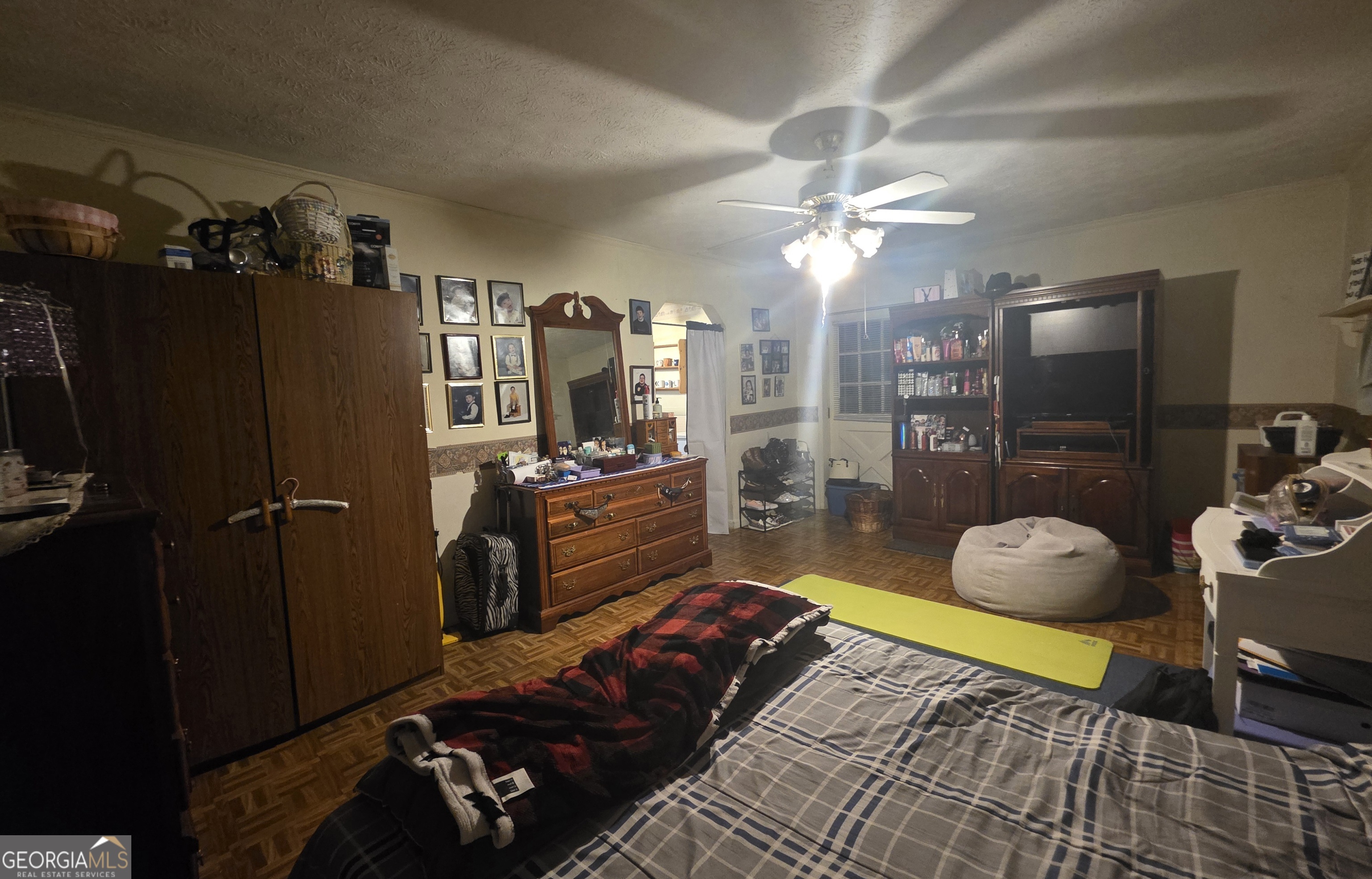 1407 Rainbow Circle Griffin, GA 30224 - Photo 21 of 23 a bedroom with furniture and a chandelier