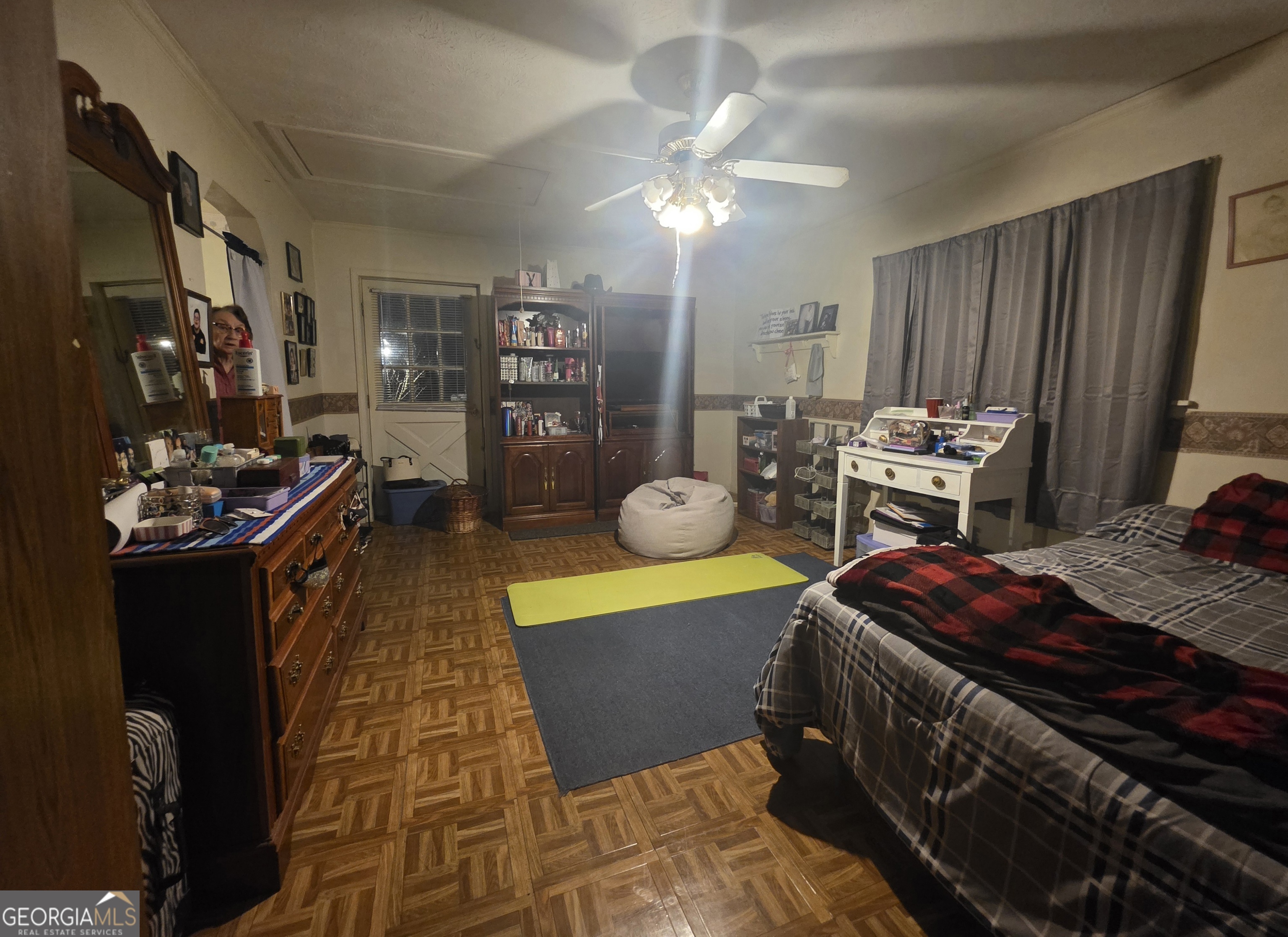 1407 Rainbow Circle Griffin, GA 30224 - Photo 22 of 23 a bedroom with furniture and a chandelier