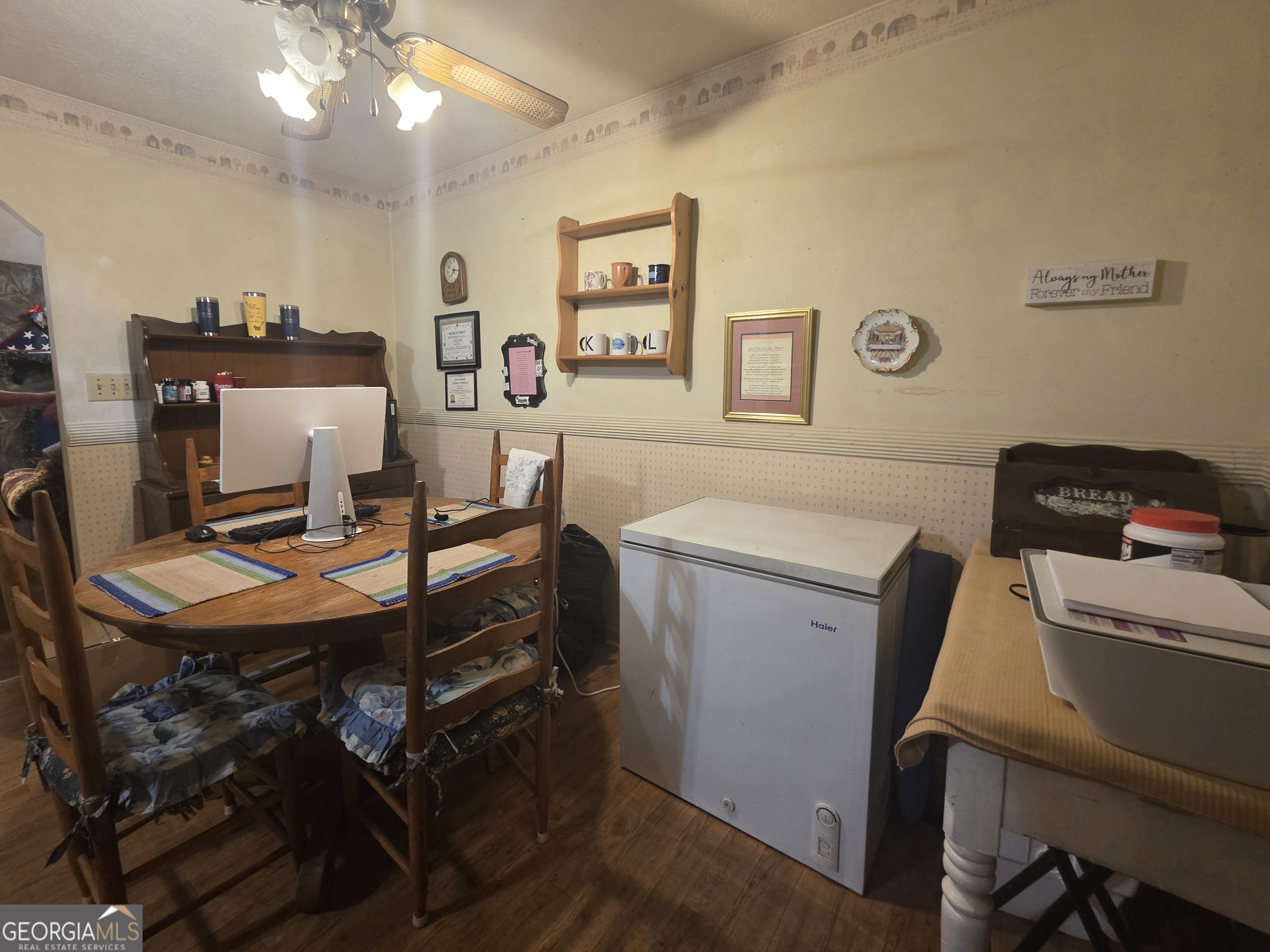 1407 Rainbow Circle Griffin, GA 30224 - Photo 9 of 23 a view of a workspace with furniture and wooden floor