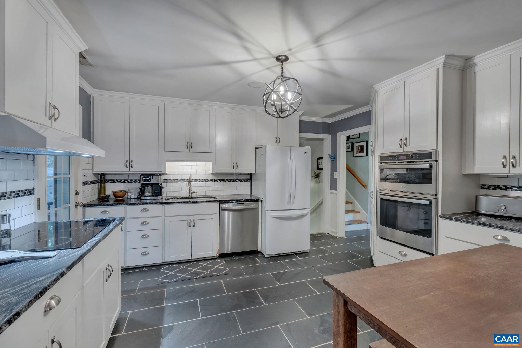 1717 Solomon Road Charlottesville, VA 22901 - Photo 15 of 41 a kitchen with stainless steel appliances a stove refrigerator sink and cabinets