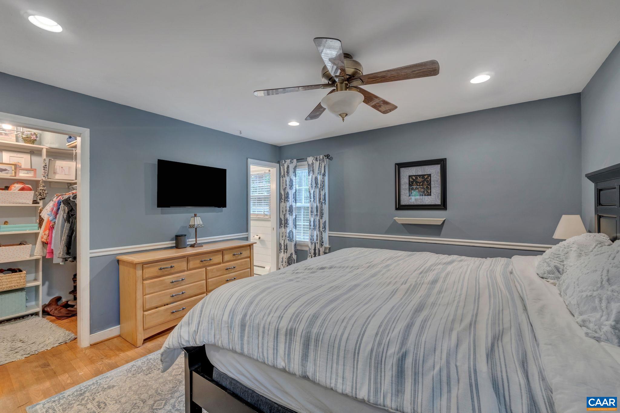 1717 Solomon Road Charlottesville, VA 22901 - Photo 19 of 41 a bedroom with a bed and a flat screen tv