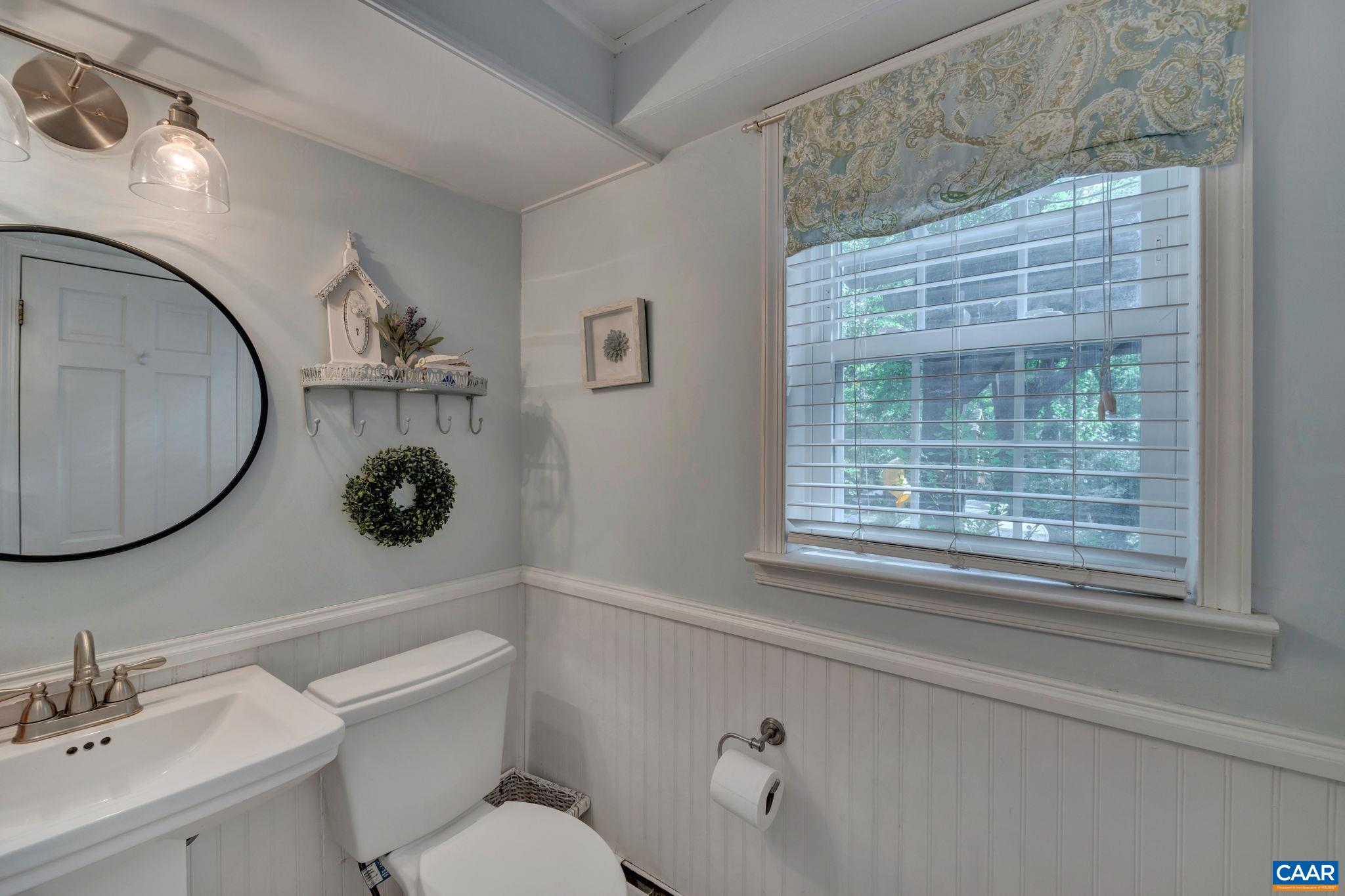 1717 Solomon Road Charlottesville, VA 22901 - Photo 29 of 41 a bathroom with a toilet sink and mirror
