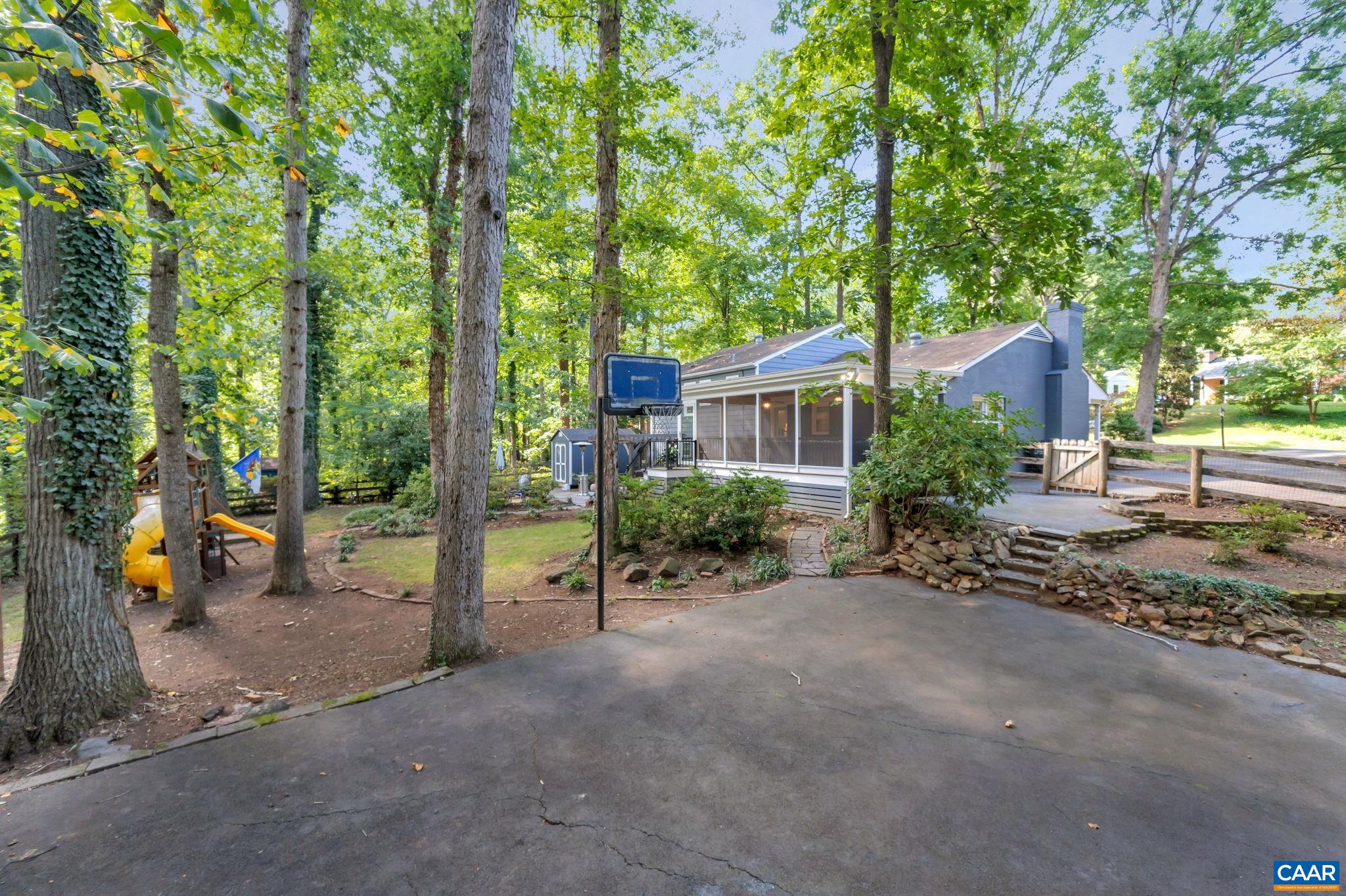 1717 Solomon Road Charlottesville, VA 22901 - Photo 35 of 41 a view of a road with large trees and a small barn