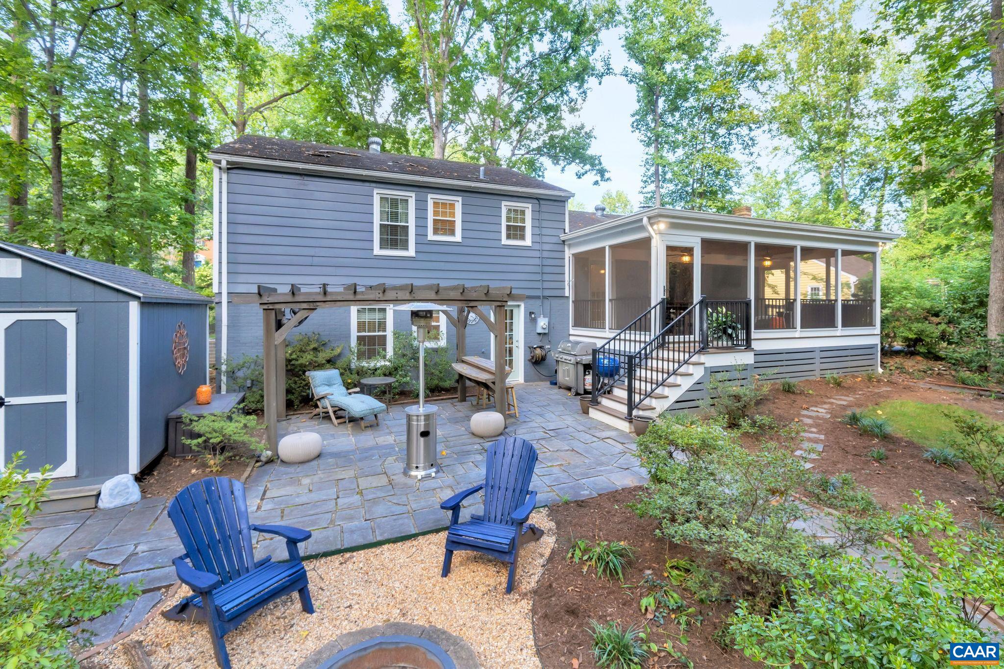 1717 Solomon Road Charlottesville, VA 22901 - Photo 38 of 41 a view of a patio with table and chairs potted plants and large tree
