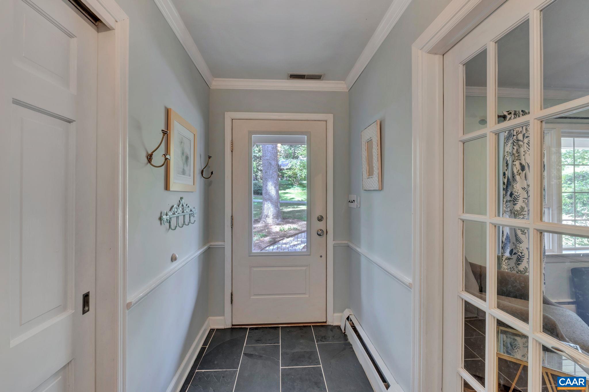 1717 Solomon Road Charlottesville, VA 22901 - Photo 8 of 41 a view of an entryway with wooden floor and a livingroom