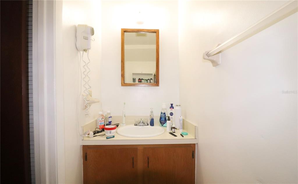 2300 Southwest 43rd Street, Unit T3 ROOM C Gainesville, FL 32607 - Photo 17 of 27 a bathroom with a sink and a mirror
