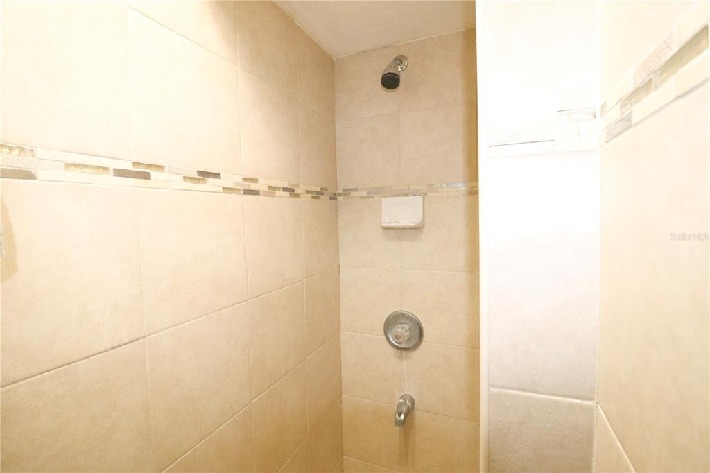 2300 Southwest 43rd Street, Unit T3 ROOM C Gainesville, FL 32607 - Photo 19 of 27 a bathroom with a shower