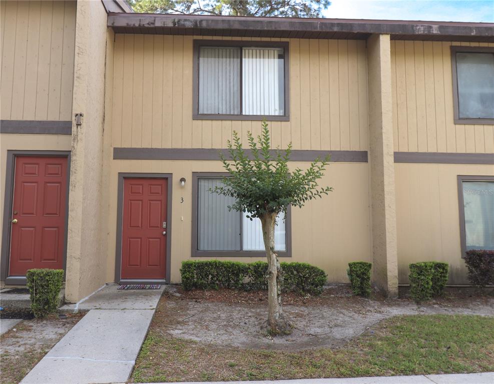 2300 Southwest 43rd Street, Unit T3 ROOM C Gainesville, FL 32607 - Photo 2 of 27 a potted plant in front of a door
