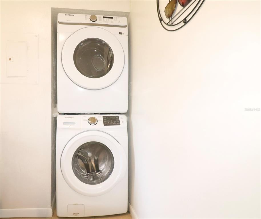 2300 Southwest 43rd Street, Unit T3 ROOM C Gainesville, FL 32607 - Photo 23 of 27 a utility room with dryer and washer