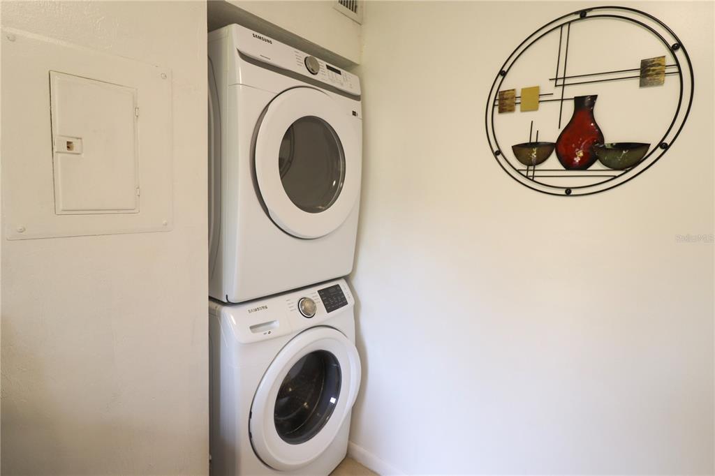 2300 Southwest 43rd Street, Unit T3 ROOM C Gainesville, FL 32607 - Photo 24 of 27 a view of a hallway with washer and a dryer