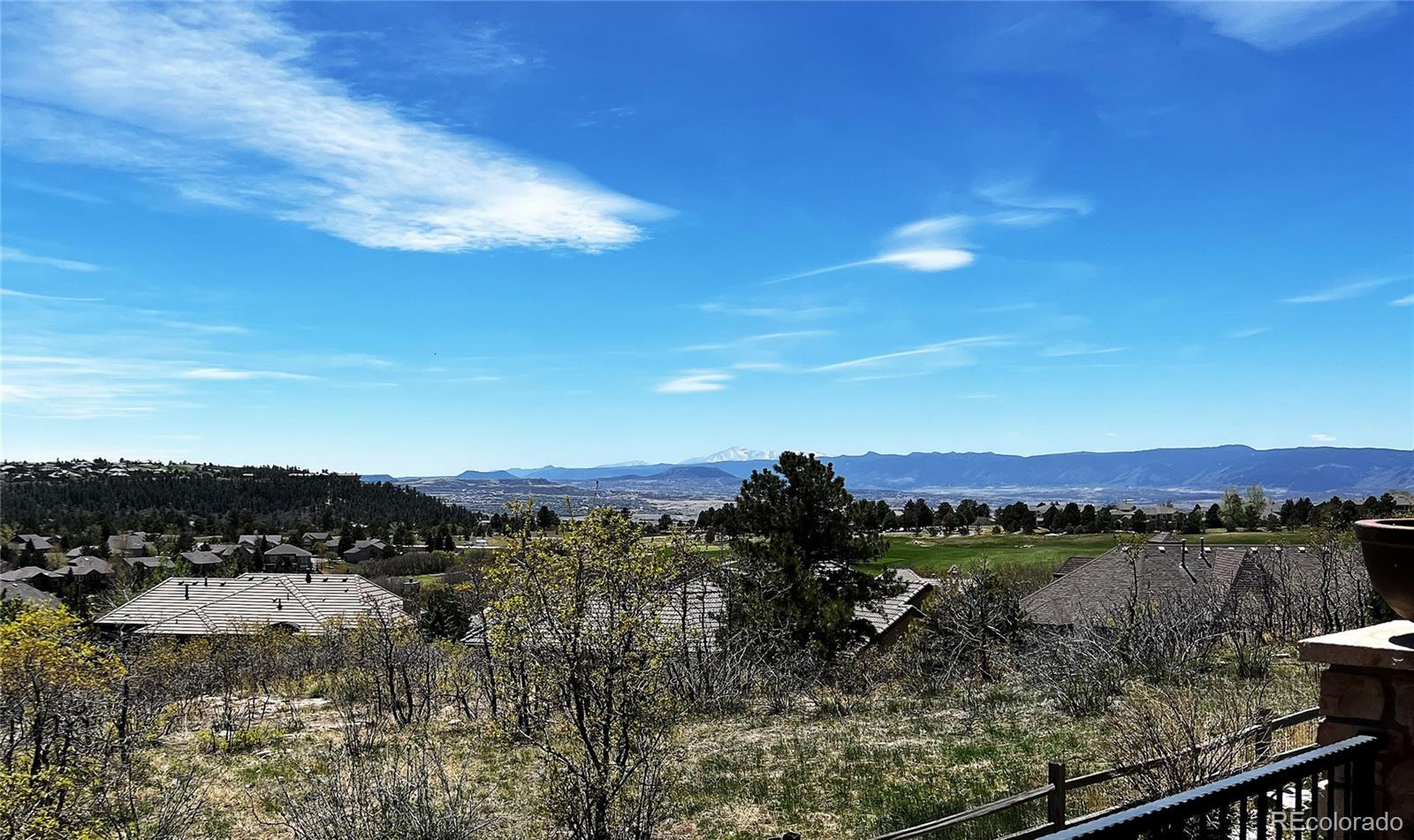 1254 Buffalo Ridge Road Castle Pines, CO 80108 - Photo 11 of 40 a view of a lake