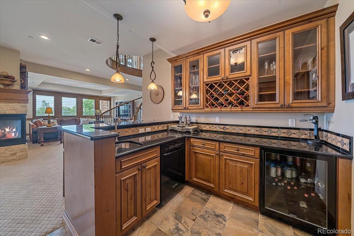 1254 Buffalo Ridge Road Castle Pines, CO 80108 - Photo 28 of 40 a kitchen with a stove and a sink