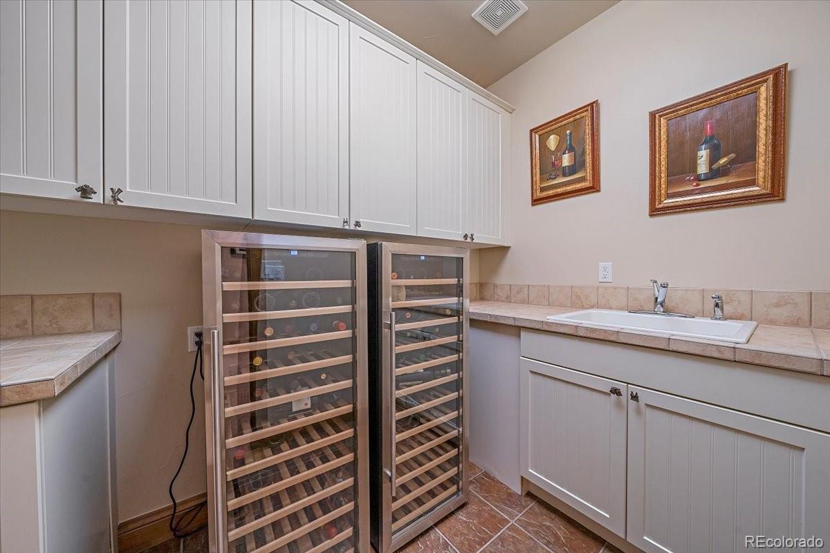 1254 Buffalo Ridge Road Castle Pines, CO 80108 - Photo 36 of 40 a view of cabinets and sink