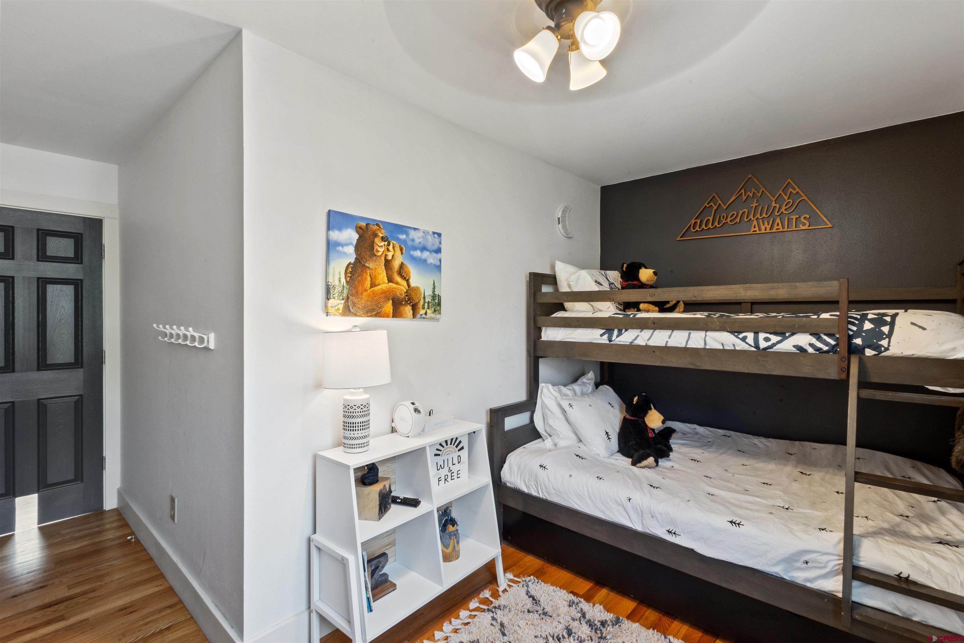 301 West 3rd Street Creede, CO 81130 - Photo 11 of 28 a room with a bed and a dresser