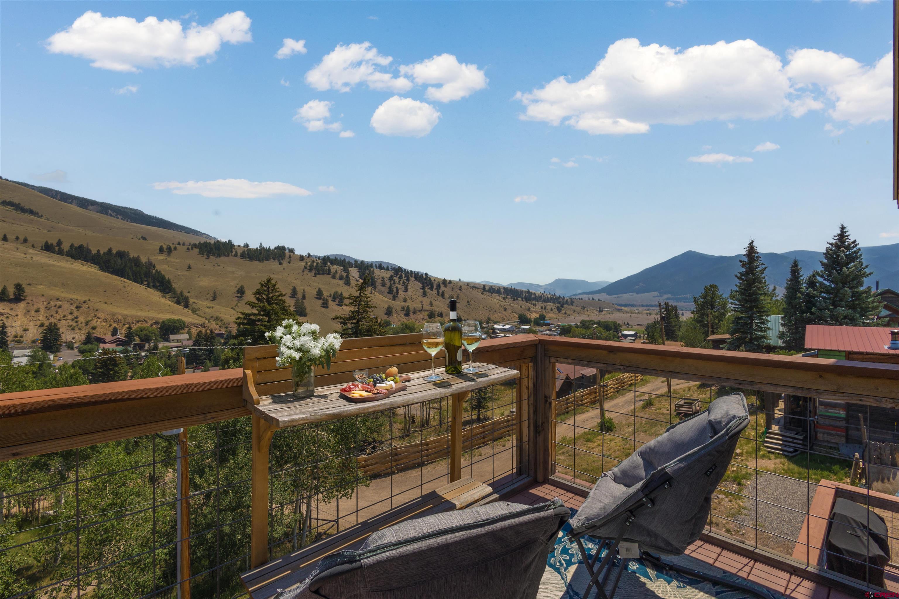 301 West 3rd Street Creede, CO 81130 - Photo 24 of 28 a view of a balcony with couches and wooden floor