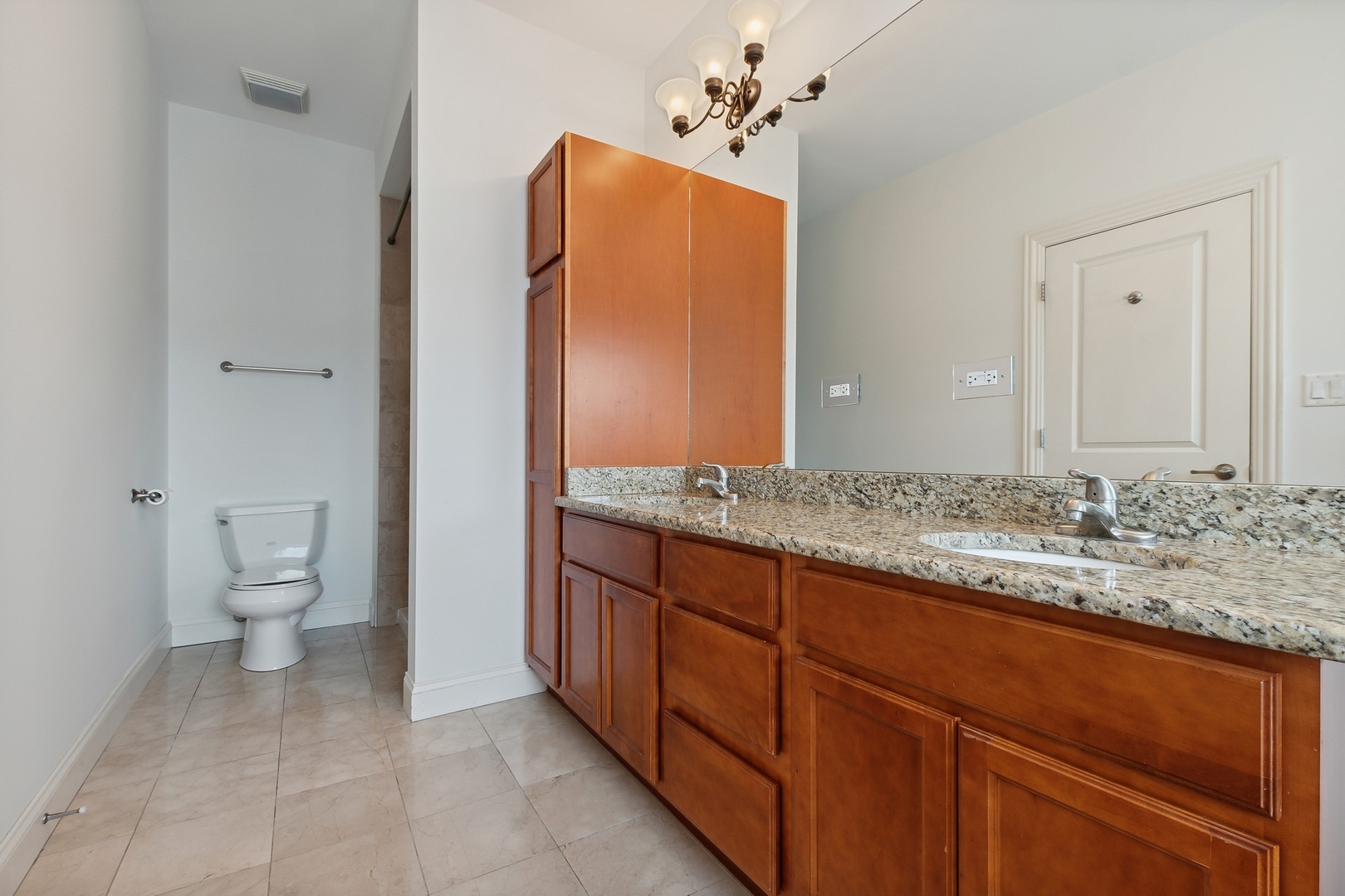 10028 South Roberts Road Palos Hills, IL 60465 - Photo 8 of 15 a bathroom with a granite countertop sink and a toilet