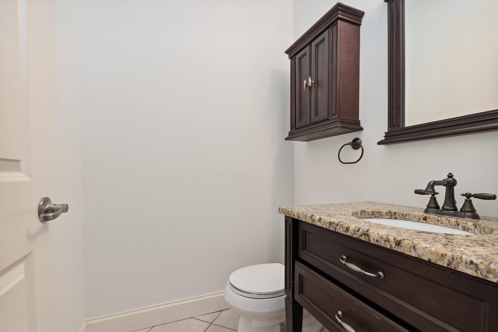 10028 South Roberts Road Palos Hills, IL 60465 - Photo 9 of 15 a bathroom with a granite countertop sink and a toilet
