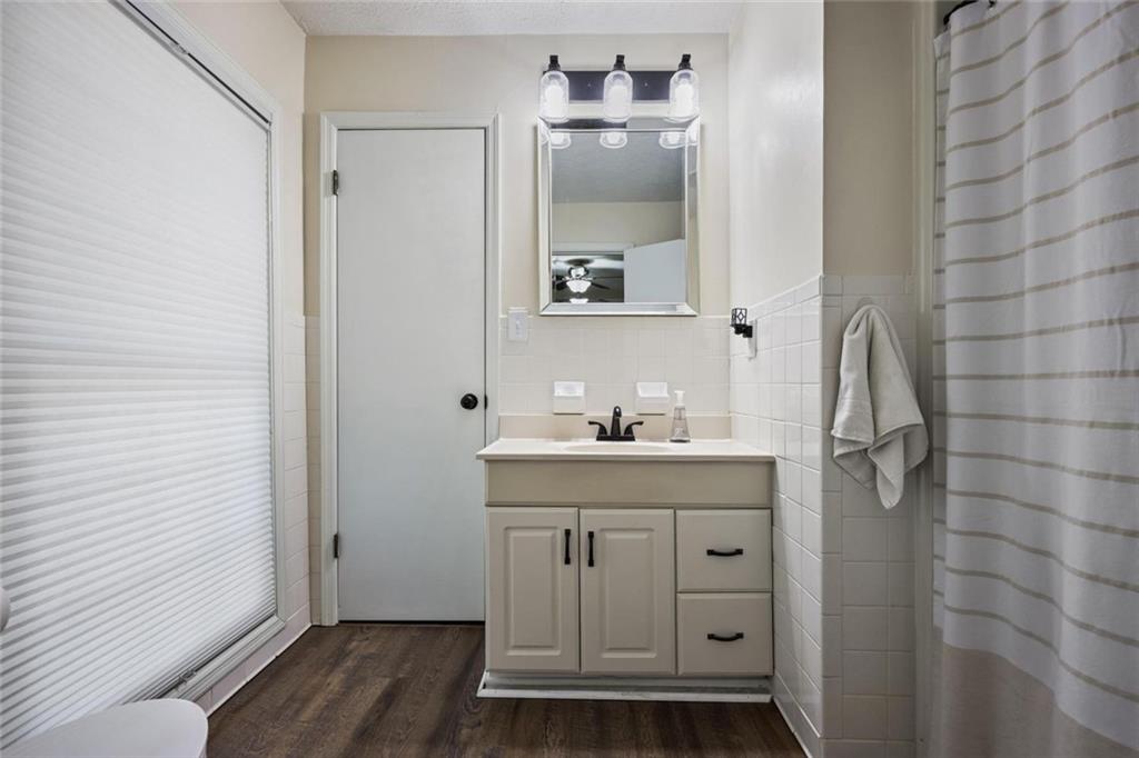 4505 Cochran Mill Road Fairburn, GA 30213 - Photo 27 of 36 a bathroom with a double vanity sink and mirror