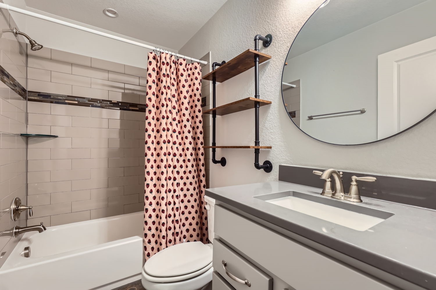 348 Adams Street Georgetown, TX 78628 - Photo 9 of 11 The lower level bathrooms serves both of the secondary bedrooms, with ample storage space!