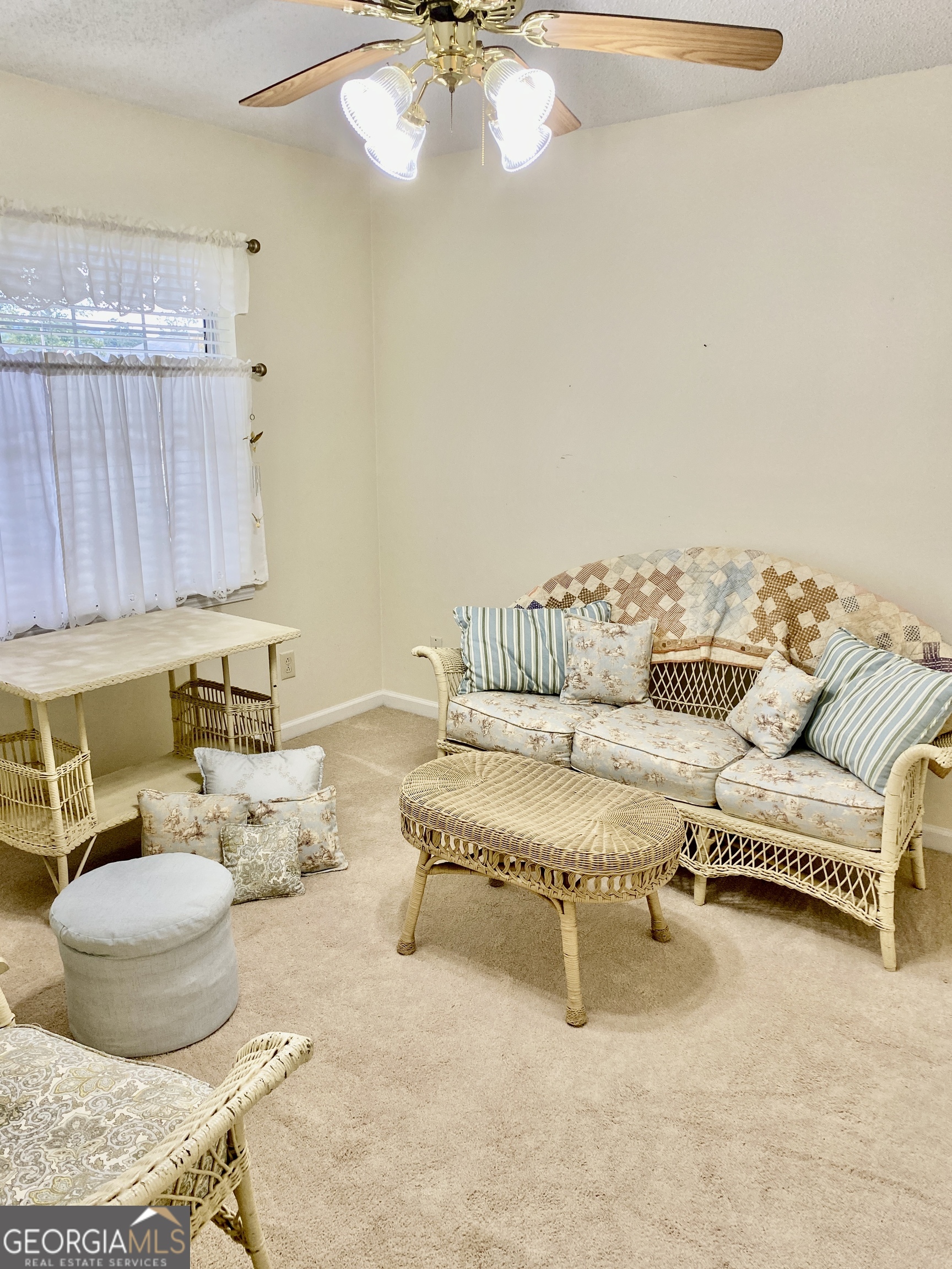 38 Boulder Drive Northwest Rome, GA 30165 - Photo 20 of 21 a living room with furniture and a chandelier