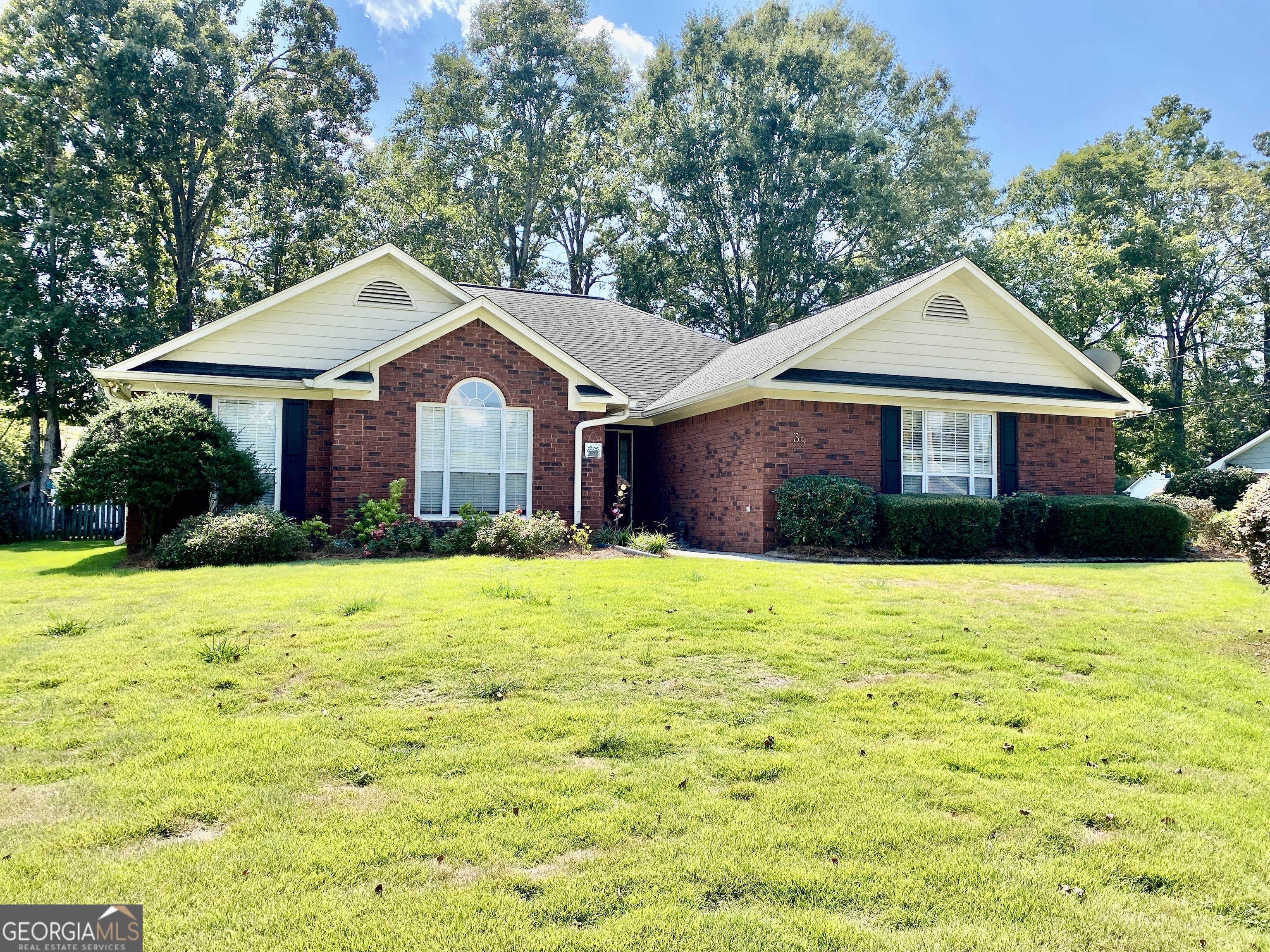 38 Boulder Drive Northwest Rome, GA 30165 - Photo 2 of 21 a front view of a house with a yard and garage