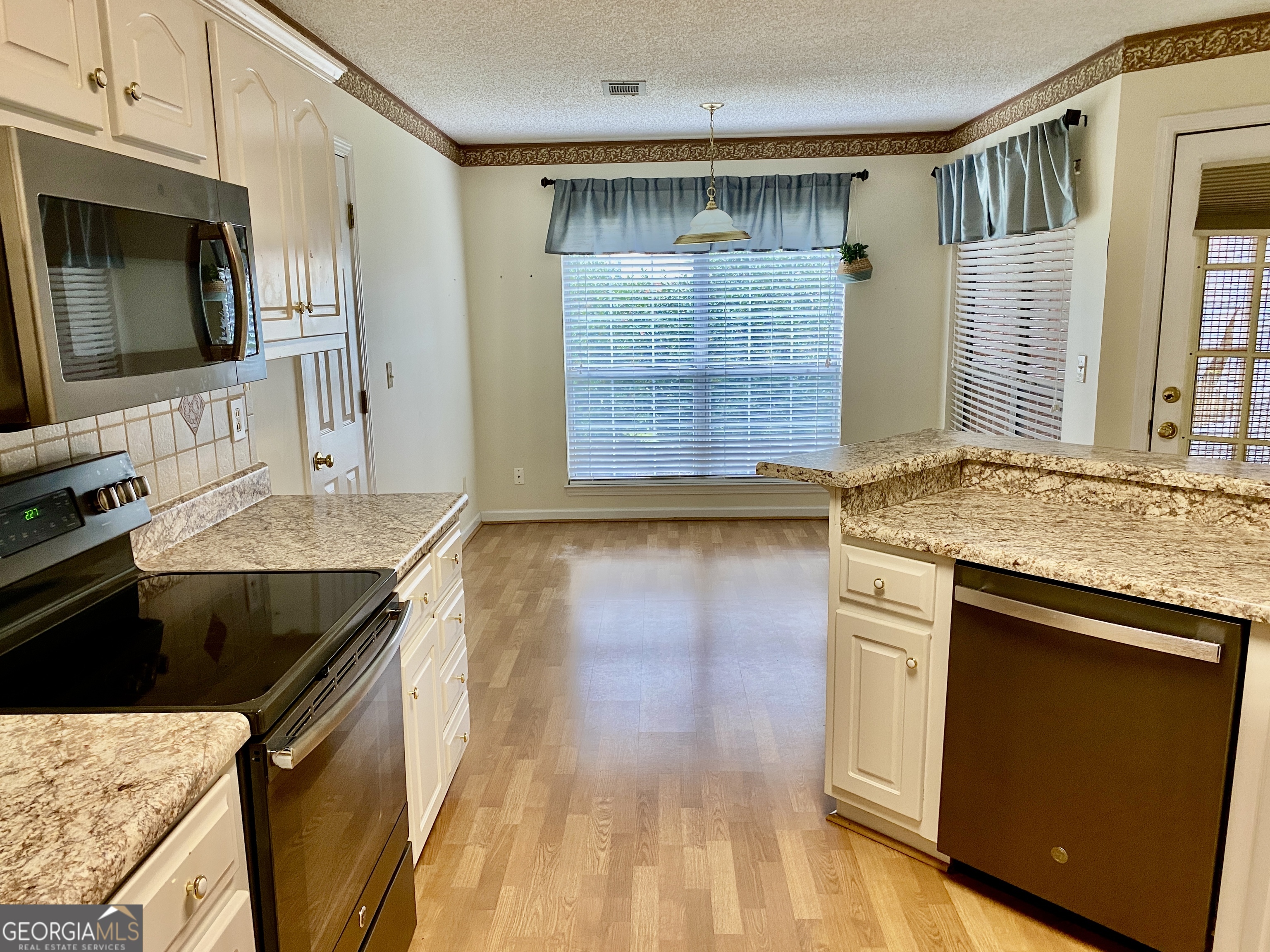 38 Boulder Drive Northwest Rome, GA 30165 - Photo 4 of 21 a kitchen with granite countertop a sink and a stove top oven