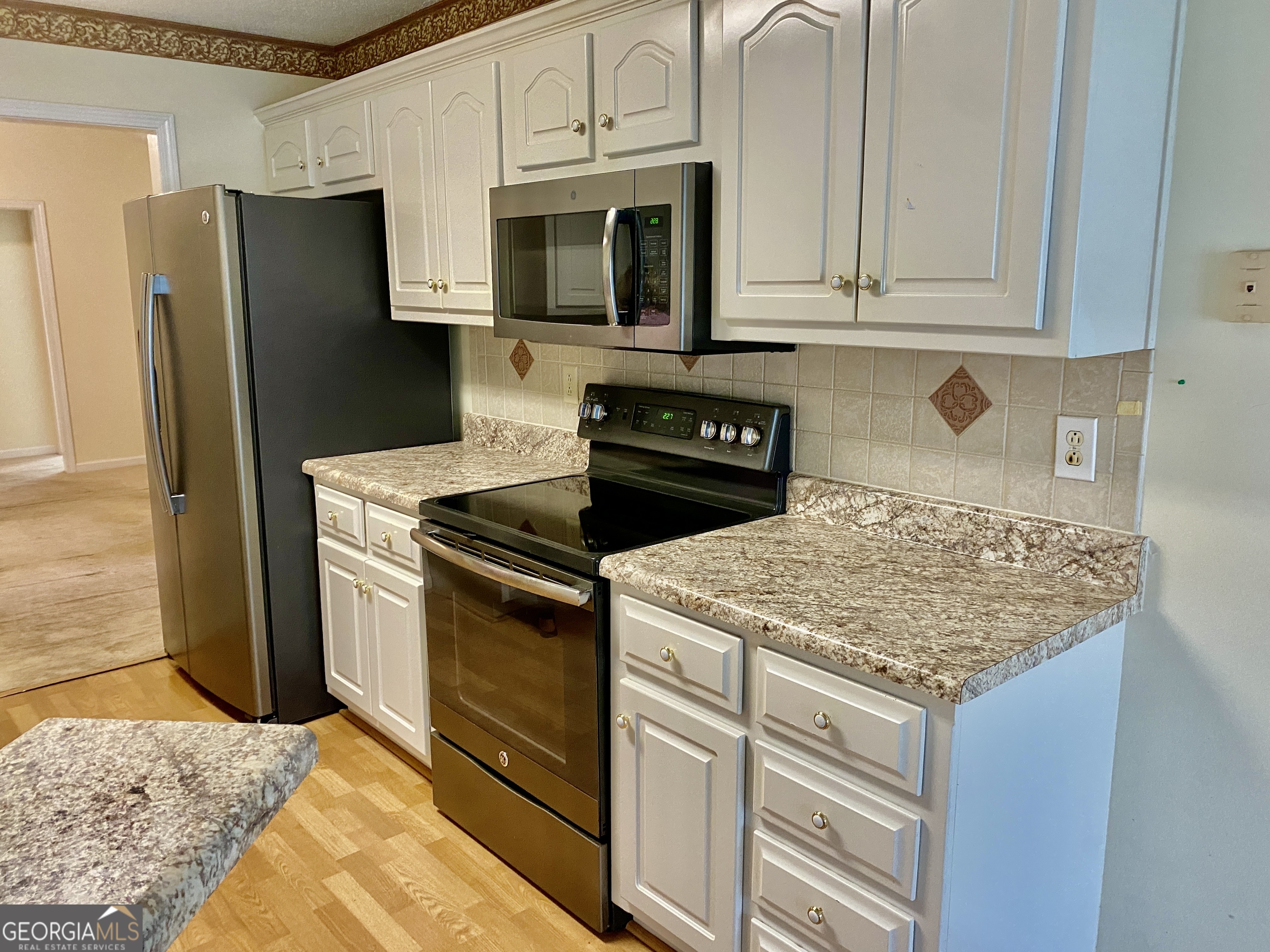 38 Boulder Drive Northwest Rome, GA 30165 - Photo 5 of 21 a kitchen with granite countertop cabinets stainless steel appliances and a counter space