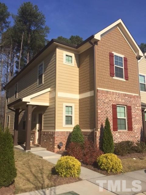 738 Wickham Ridge Road Apex, NC 27539 - Photo 1 of 23 a front view of a house with a yard